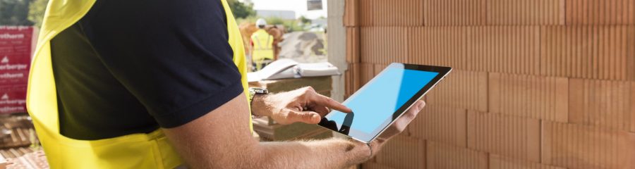 Construction worker with tablet computer, Fast Forward Commercial Excellence